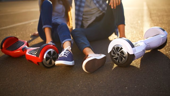 Hoverboard riders resting on the ground.