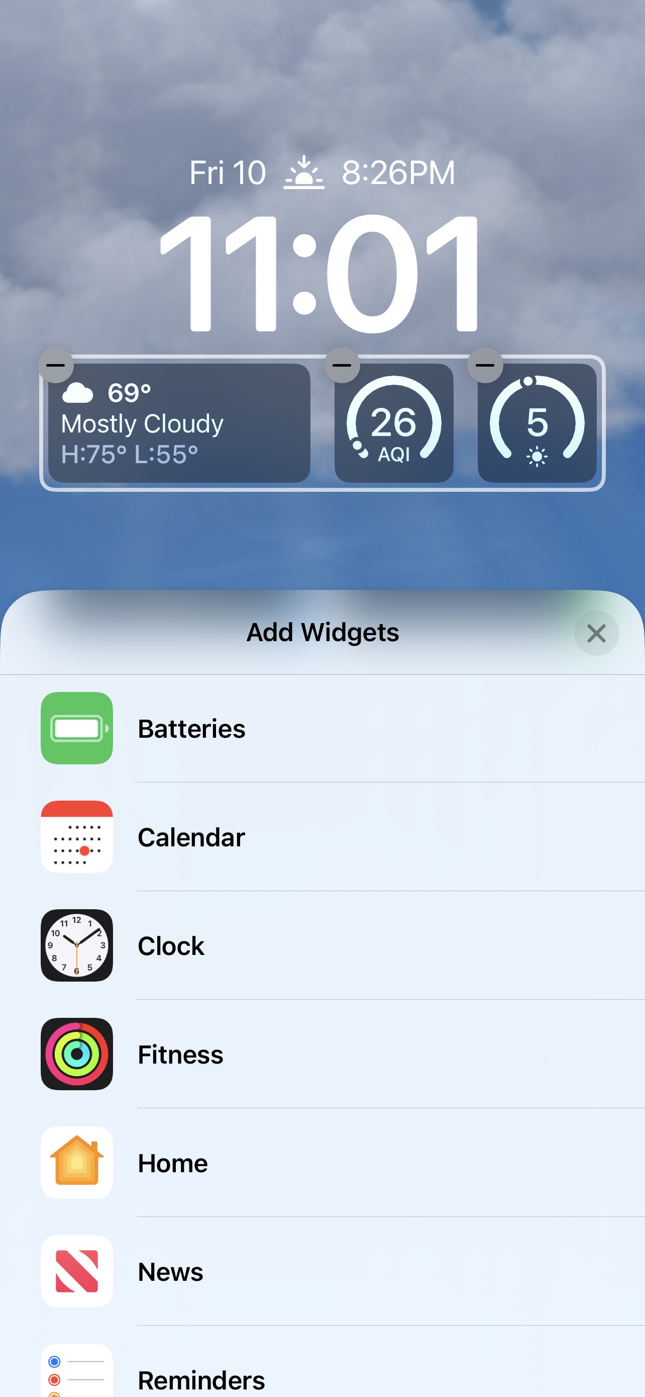 iOS 16 widgets below the clock.