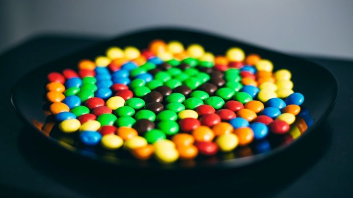 Colorful Skittles-like candy in a bowl.