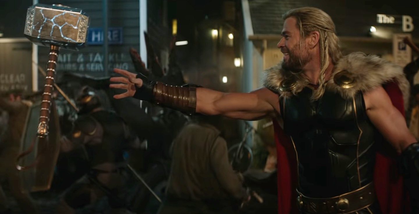 A surprised and excited Thor (Chris Hemsworth) foolishly believing he can get Mjolnir back.